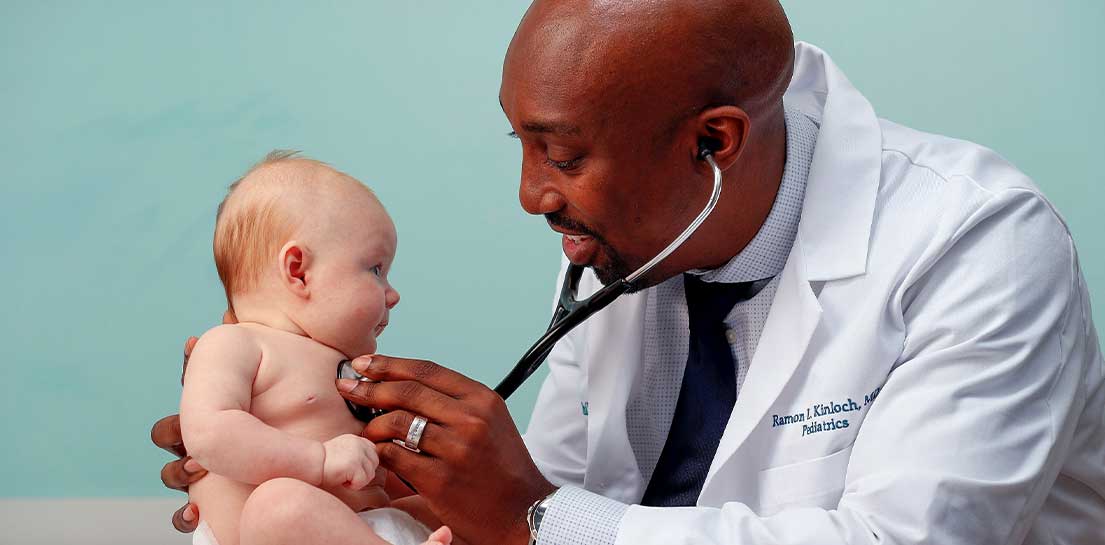 Doctor with infant Doctor with infant